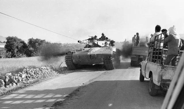 IDF Merkava tank advancing on the road to Beirut during the 1982 Israeli invasion of Lebanon