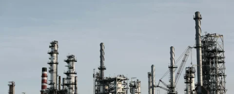 Crude oil drilling operation showing the complex infrastructure behind global oil markets