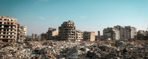 Ruins and smoke from active armed conflicts devastating civilian areas