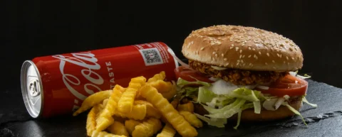 McDonald's CEO viral burger video screenshot showing Chris Kempczinski's reluctant bite