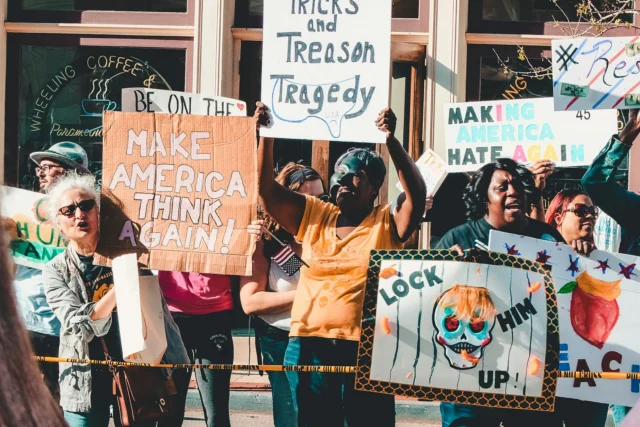 Protest signs at a political rally about racial equality