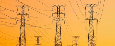 Data center energy demand visualization showing power grid infrastructure and electrical towers