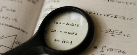 Mathematical notation and digital patterns representing online encryption mathematics