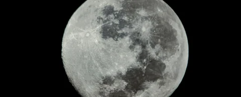 Orion spacecraft approaching the Moon during a crewed lunar mission