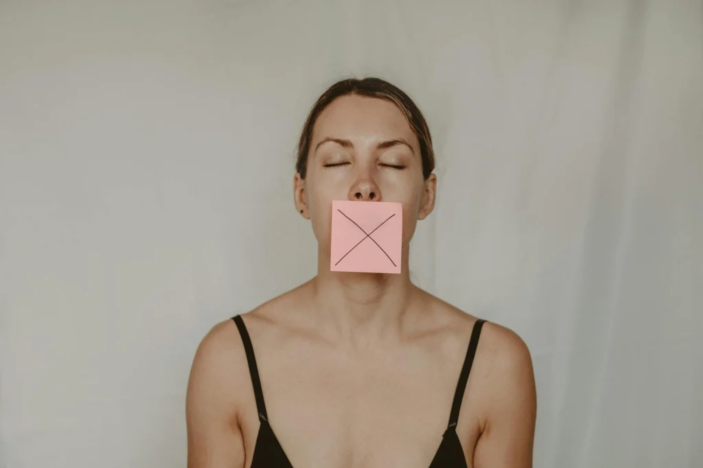 A silhouette against a screen displaying deleted content notifications