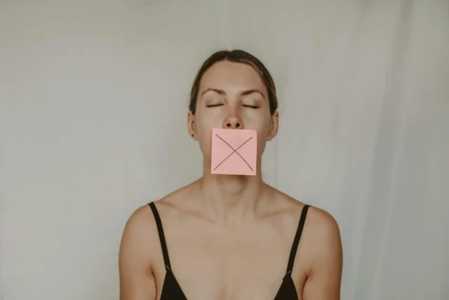 A silhouette against a screen displaying deleted content notifications