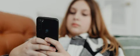Gavel and smartphone representing landmark social media addiction verdict against Meta and YouTube