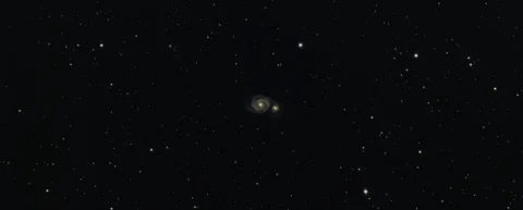 Galaxy cluster showcasing dark matter evidence through gravitational lensing effects