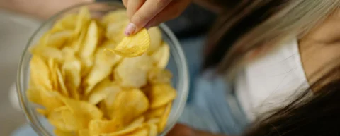 Cheetos demonstrating vanishing caloric density - puffed snacks that dissolve quickly and trick the brain