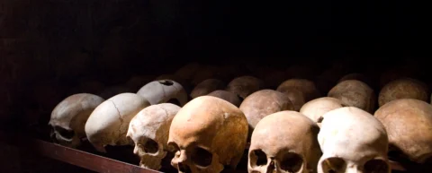 Memorial site displaying rwandan genocide warning signs and historical documentation