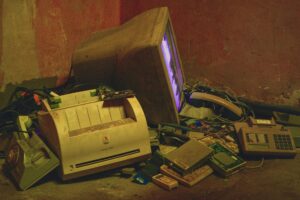 Discarded electronics illustrating planned obsolescence economics