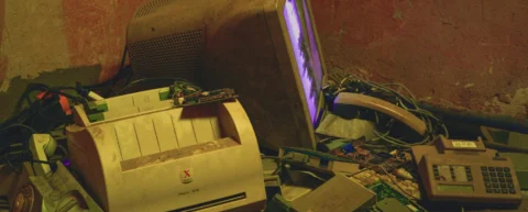 Discarded electronics illustrating planned obsolescence economics