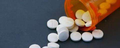 Prescription opioid pills representing opioid marketing fraud