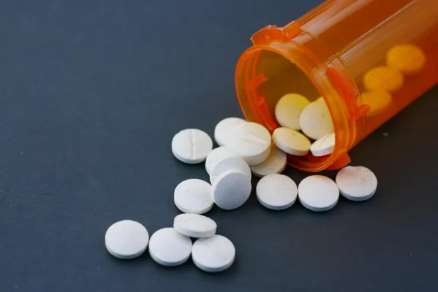 Prescription opioid pills representing opioid marketing fraud