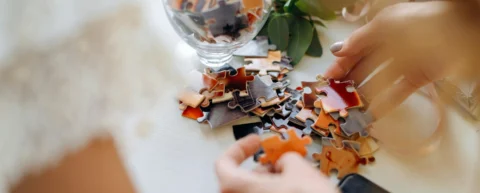 Person examining conspiracy theory psychology through fragmented information