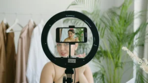 Influencer authenticity performance captured as creator prepares content behind ring light