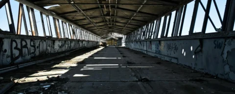 Aging bridge showing cracks and deferred infrastructure maintenance