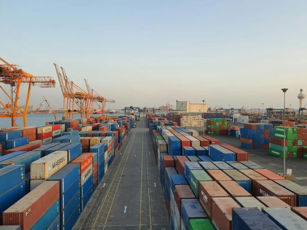 Shipping containers at port illustrating supply chain fragility in global logistics