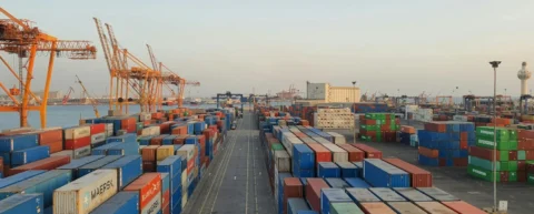 Shipping containers at port illustrating supply chain fragility in global logistics