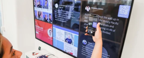 Digital screen showing algorithmic news distribution feed with ranked content