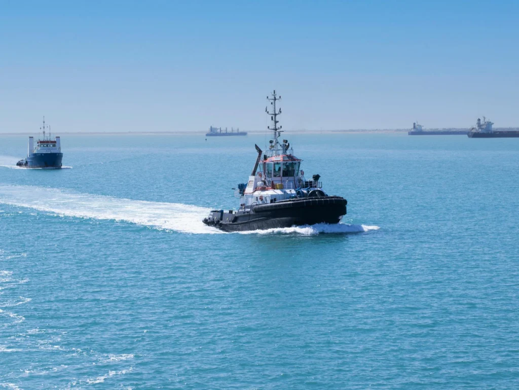 Aerial view of cargo ships transiting the Suez Canal, illustrating suez canal geopolitics