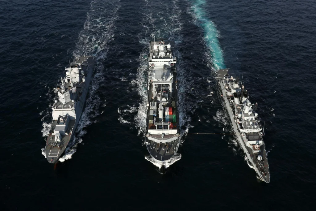 Warships at sea illustrating island nation naval power projection