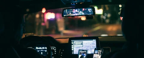 Tired rideshare driver illustrating gig economy exploitation and worker exhaustion