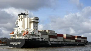 Cargo ships navigating through maritime chokepoints that control global trade routes