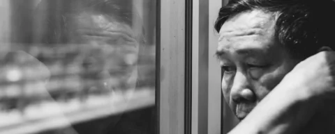 Person in midlife reflecting on life, illustrating midlife crisis psychology research