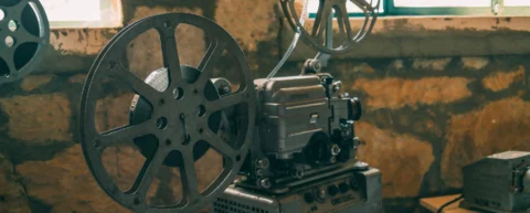Vintage film reels representing the film canon debate