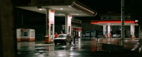 Cars lined up at a gas station during the 1970s energy crisis, illustrating the policy errors that created artificial shortages