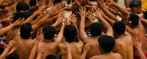 Group participating in synchronized ritual demonstrating social cohesion