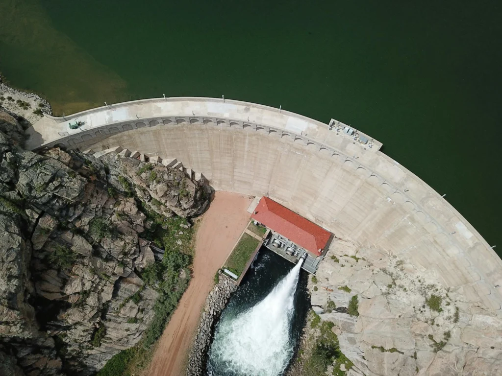 Hydroelectric dam with reservoir demonstrating renewable energy storage through gravitational potential