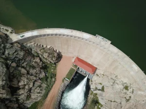 Hydroelectric dam with reservoir demonstrating renewable energy storage through gravitational potential