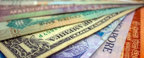 Global currency symbols illustrating the de-dollarization myth