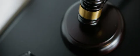 Gavel and scales representing sovereign immunity and international criminal justice