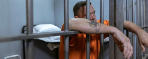 Prison corridor illustrating mass incarceration cost to taxpayers