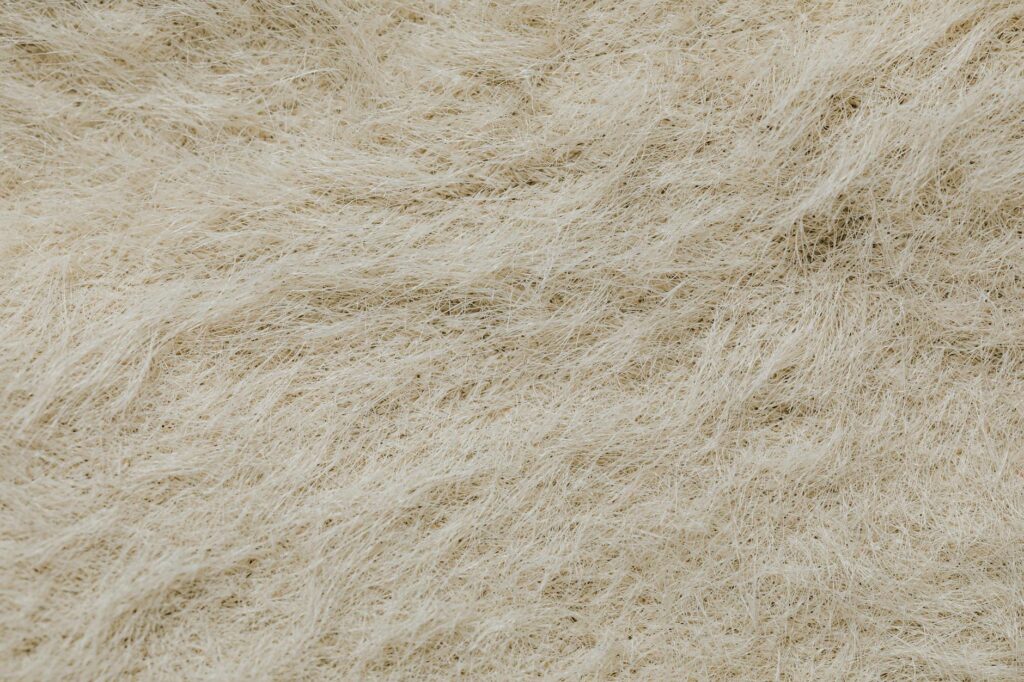 Microscopic view of synthetic fiber chemistry showing polyester textile strands