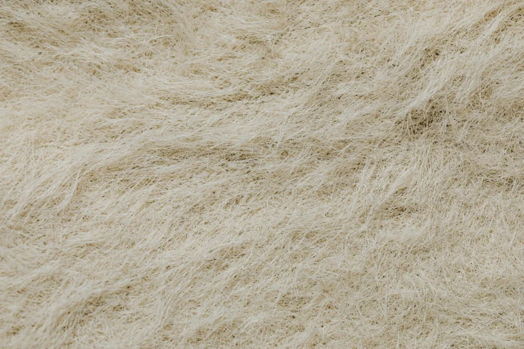 Microscopic view of synthetic fiber chemistry showing polyester textile strands