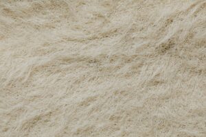 Microscopic view of synthetic fiber chemistry showing polyester textile strands