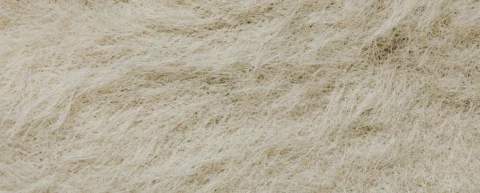 Microscopic view of synthetic fiber chemistry showing polyester textile strands