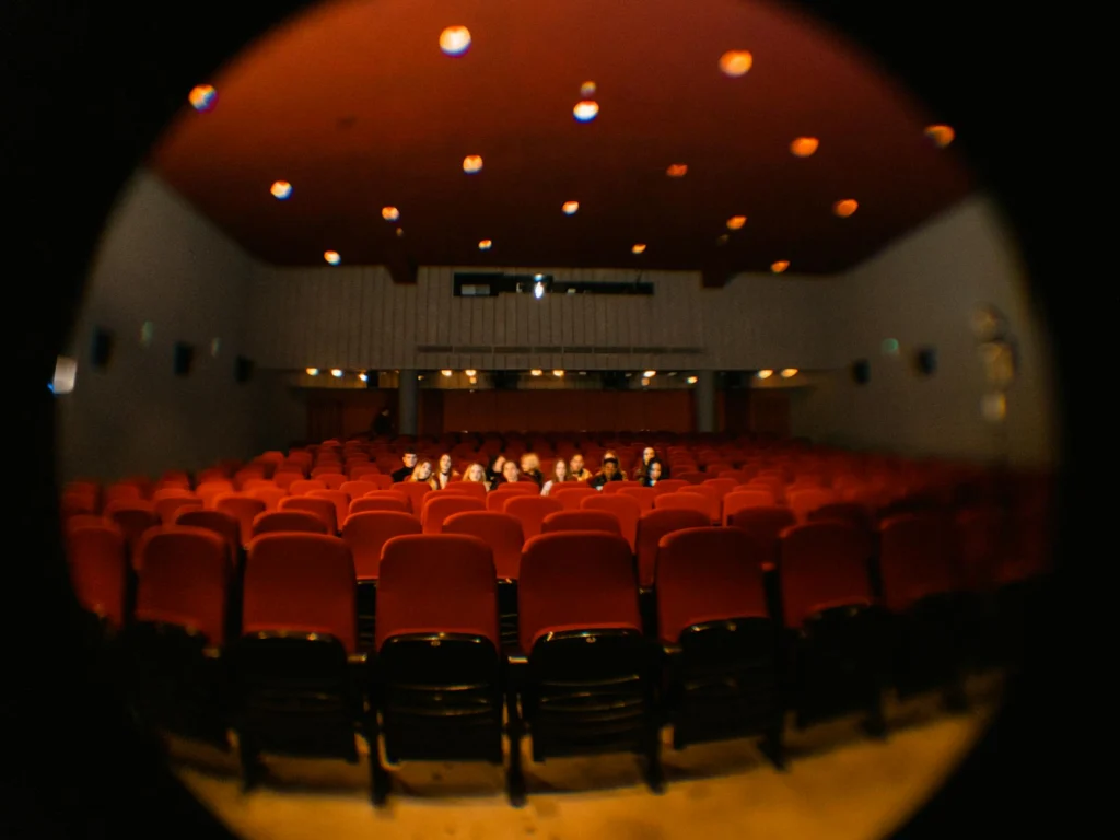 Cinema audience watching a film, representing the Bechdel Test's examination of female representation on screen