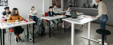 Students in a classroom representing charter school performance research