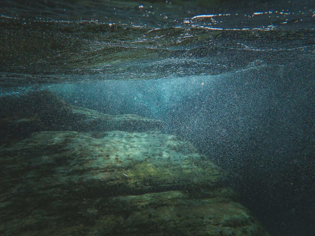 Subsea fiber optic cable being laid on the ocean floor