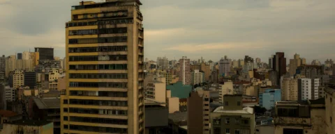Urban heat island effect visible over city skyline with heat shimmer