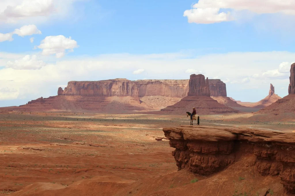 Desert landscape reminiscent of western genre mythology filmed in Monument Valley