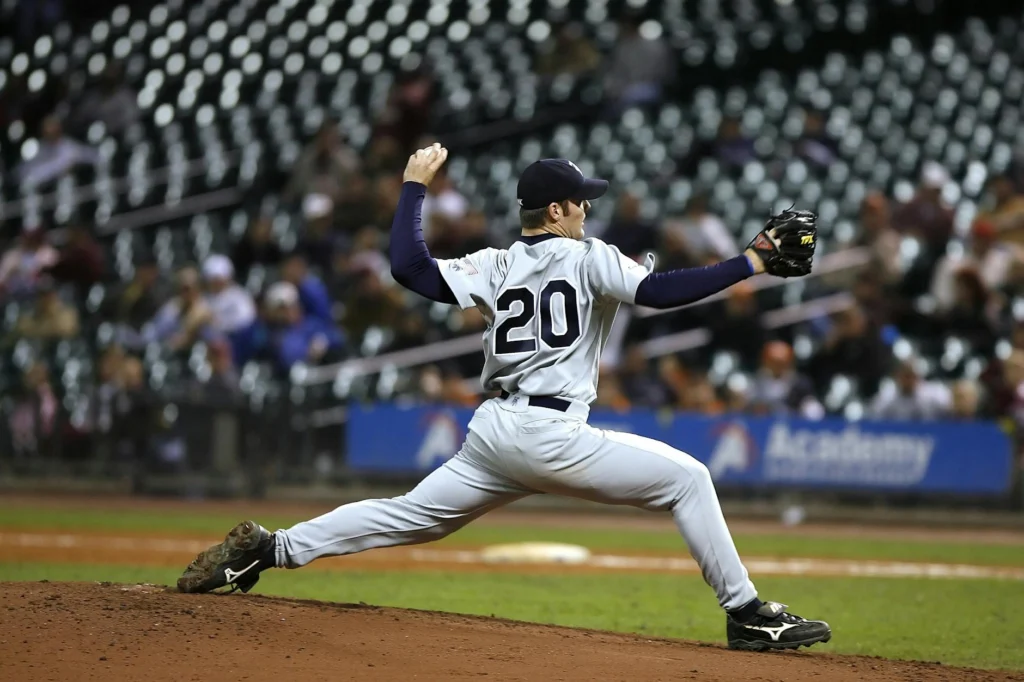 Baseball pitcher in mid-delivery demonstrating bullpen optimization mechanics