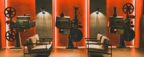 Vintage film projector illustrating Hollywood ending history