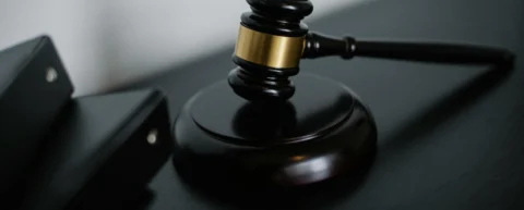 Empty international courtroom illustrating war crimes accountability and the gap in enforcement