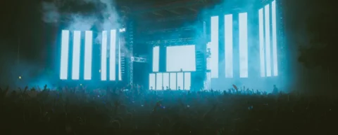 Festival scalability challenges illustrated by massive crowd at night concert